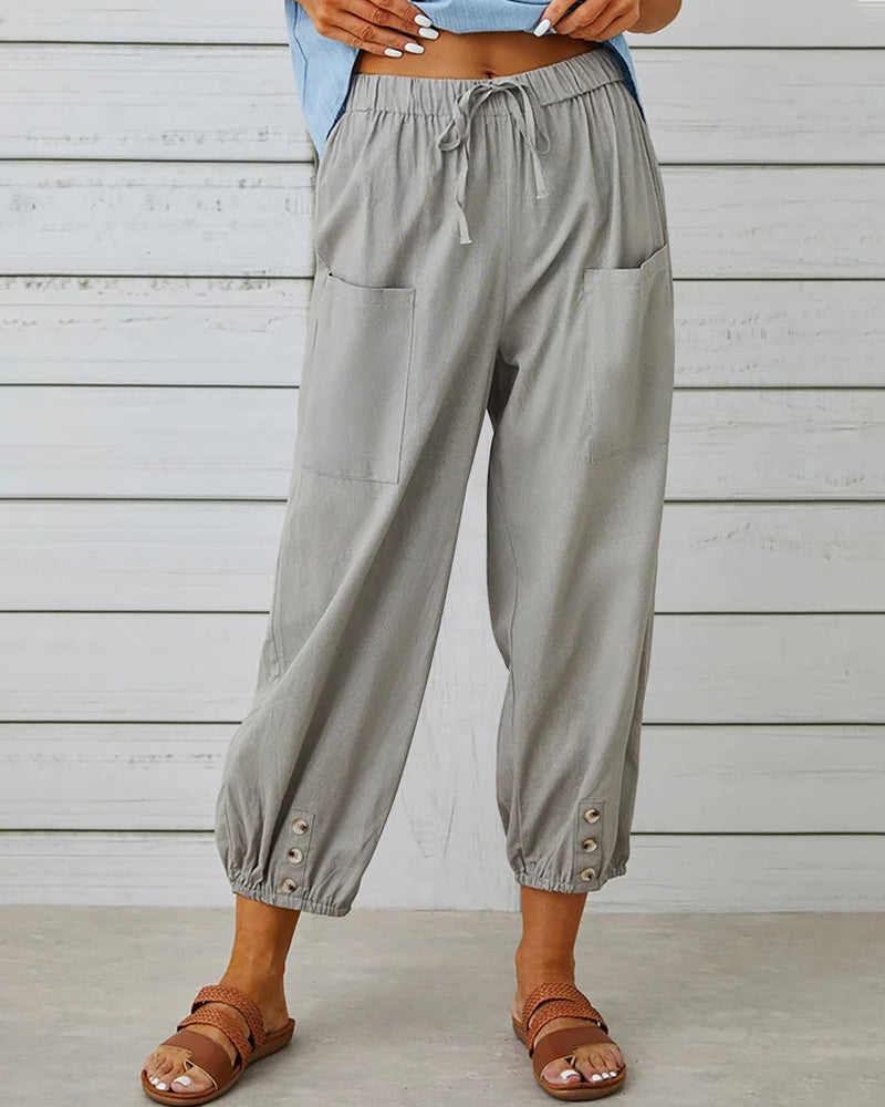 Pantalon taille haute bouton neuf points