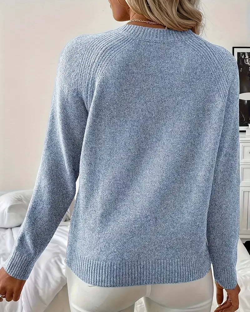 Sweter z ozdobnymi guzikami i rękawem raglanowym