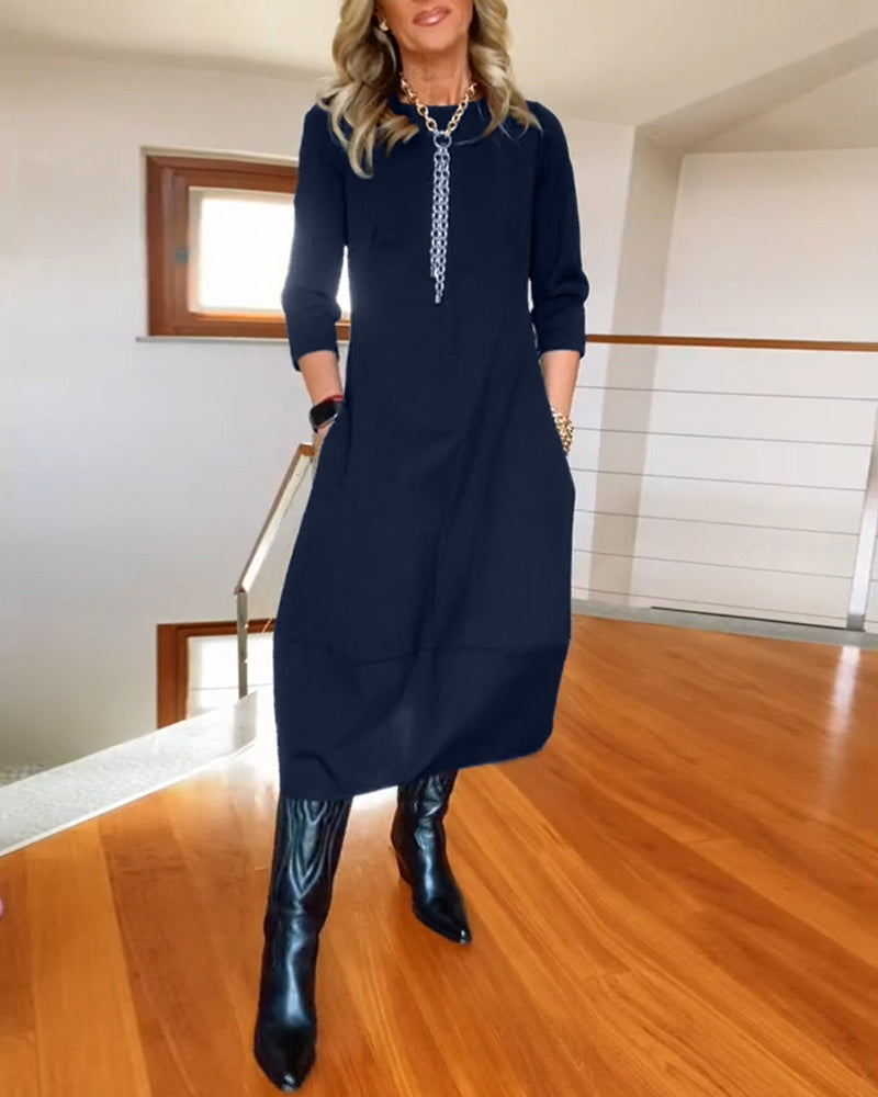 Robe élégante de couleur unie avec poche et col rond