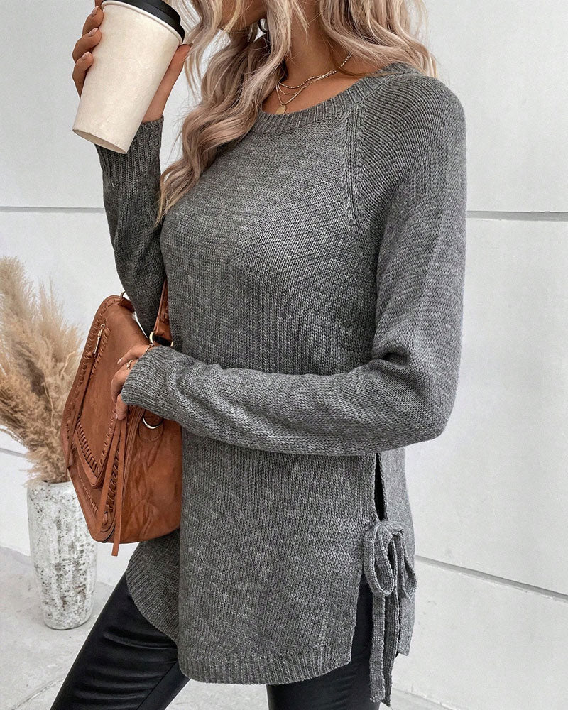 Sweter z rękawami reglanowymi i wiązaniem z boku