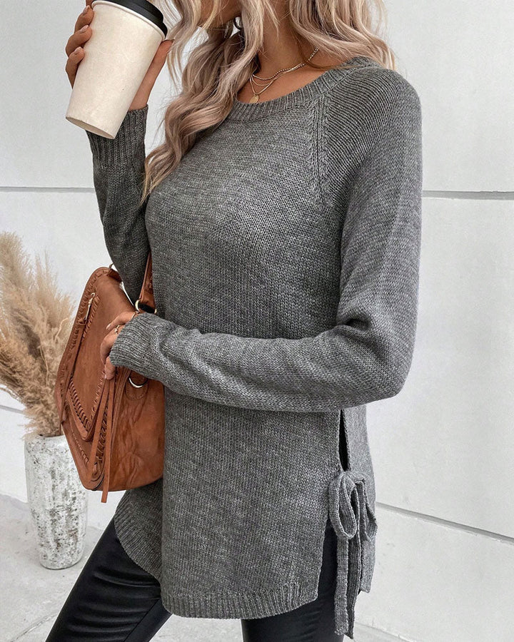 Sweter z rękawami reglanowymi i wiązaniem z boku