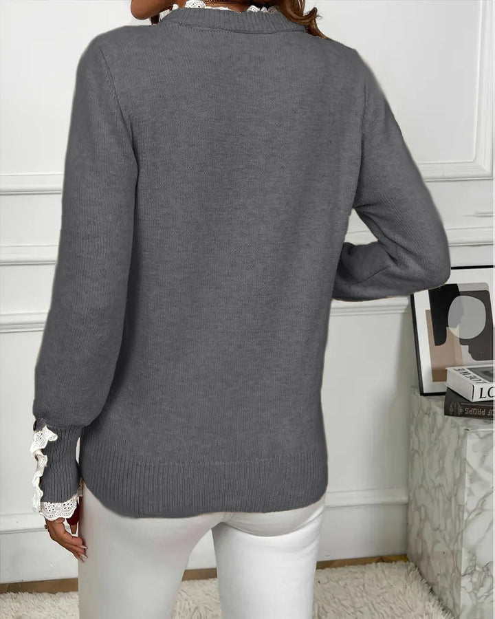 Elegancki sweter zdobiony koronką
