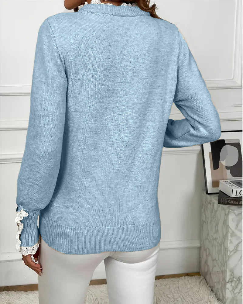 Elegancki sweter zdobiony koronką
