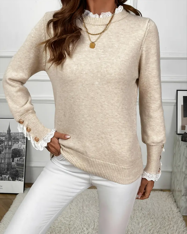 Elegancki sweter zdobiony koronką