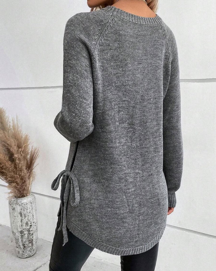 Sweter z rękawami reglanowymi i wiązaniem z boku
